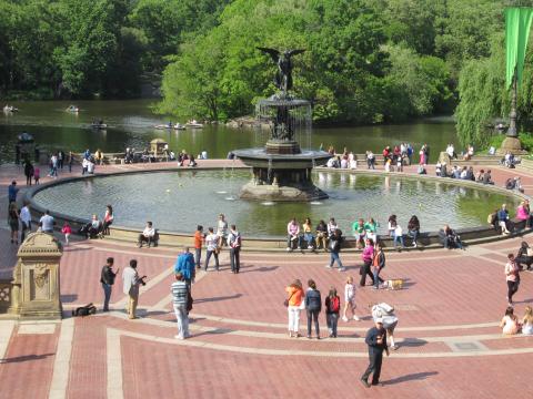 Fountain at Central Park surrounded by people