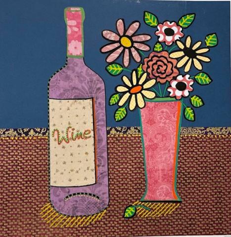 wine bottle and flowers in vase