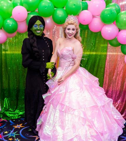 Green and Pink witches posing